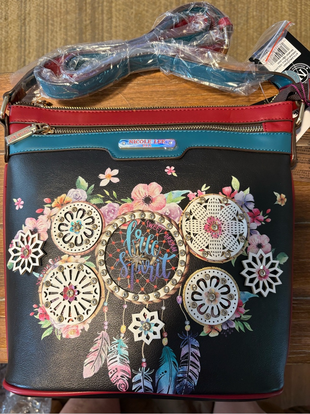 Nicole Lee Black Floral Dreamcatcher Crossbody with Teal and Red Trim
